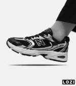 کفش کتانی مردانه و زنانه مشکی نقره ای NEW BALANCE 530 مدل 5508 - Image 2
