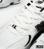 کفش کتانی مردانه و زنانه سفید مشکی NEW BALANCE 530 مدل 4974 - Image 8